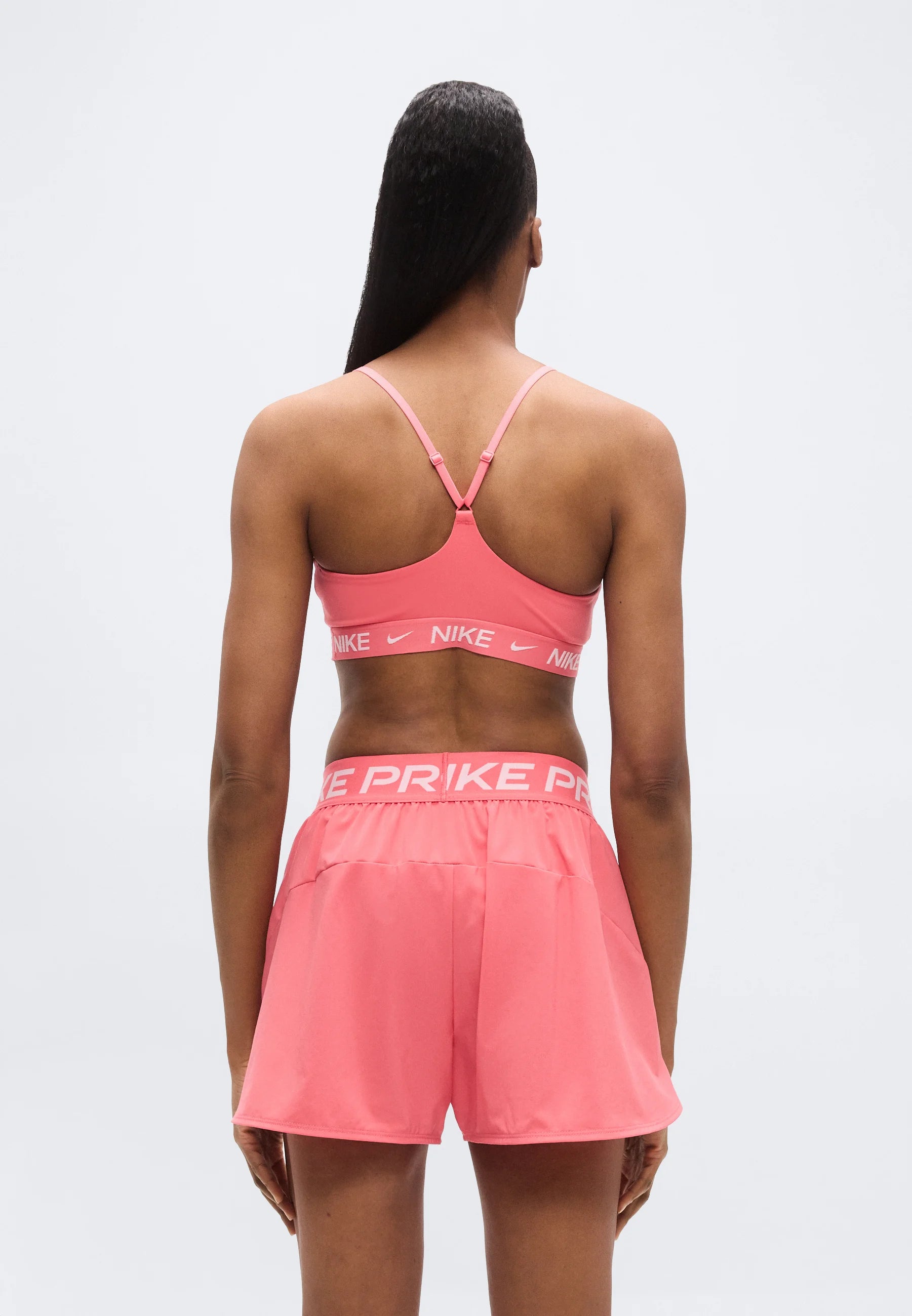 Nike Performance Indy Light Stütz-BH – Meereskoralle, Weiß