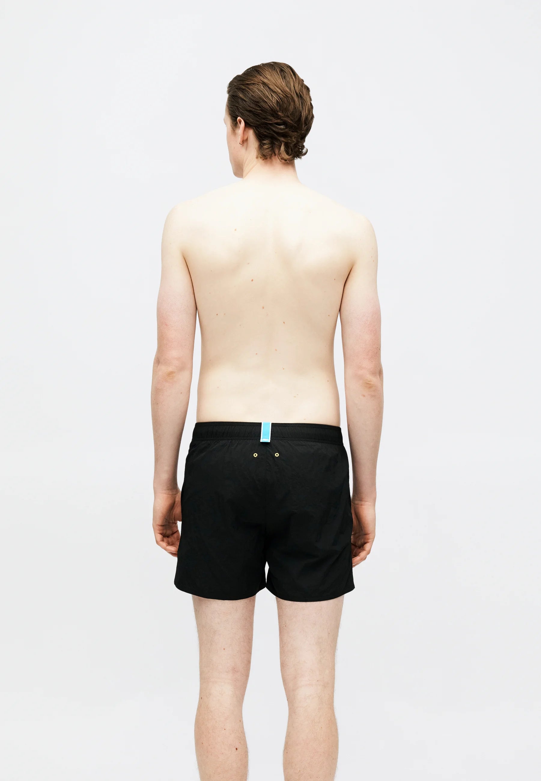 Strandshorts mit Arena-Grafik – Schwarz