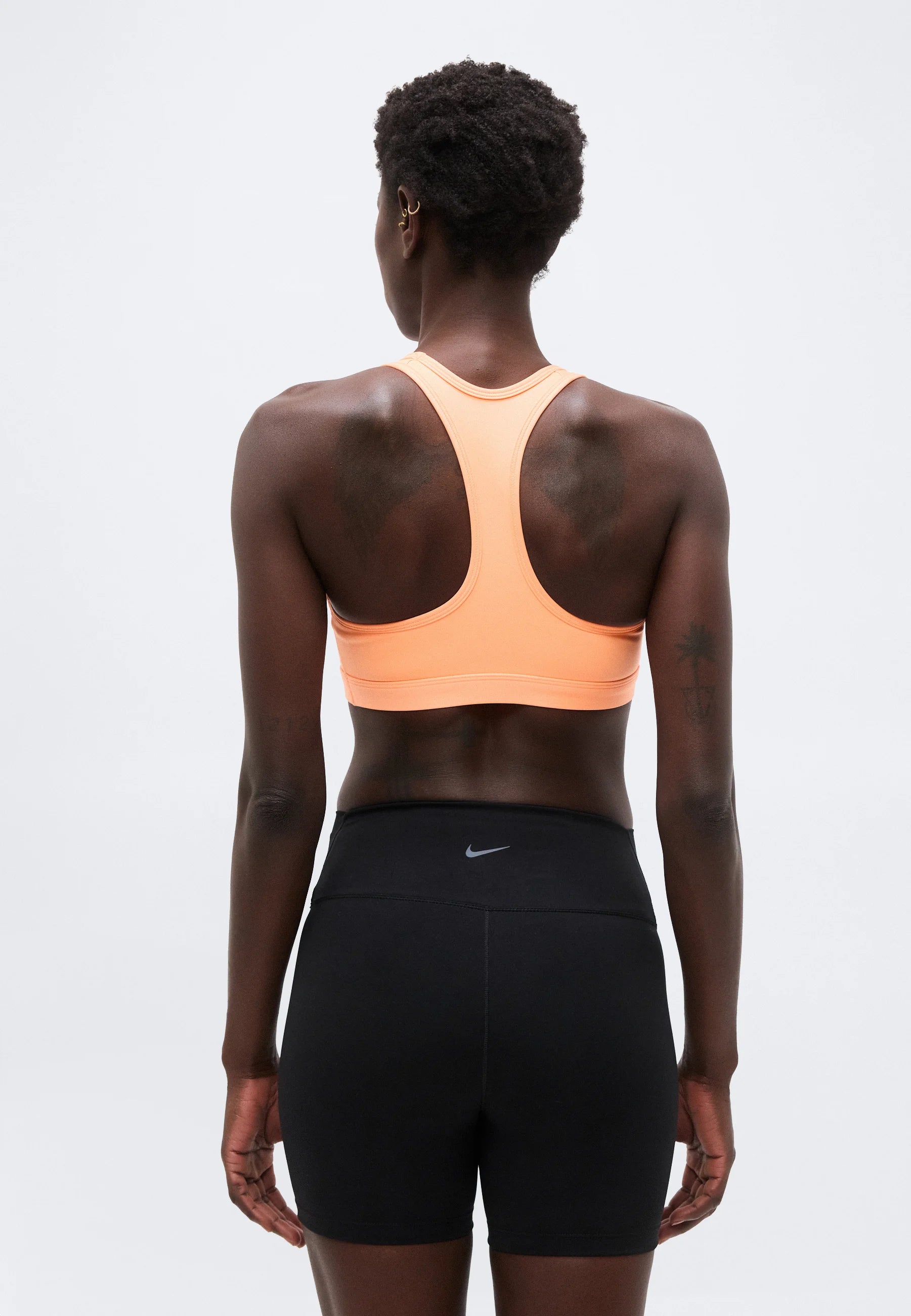 Sportovní podprsenka Nike Medium Support – oranžová Pulse, bílá